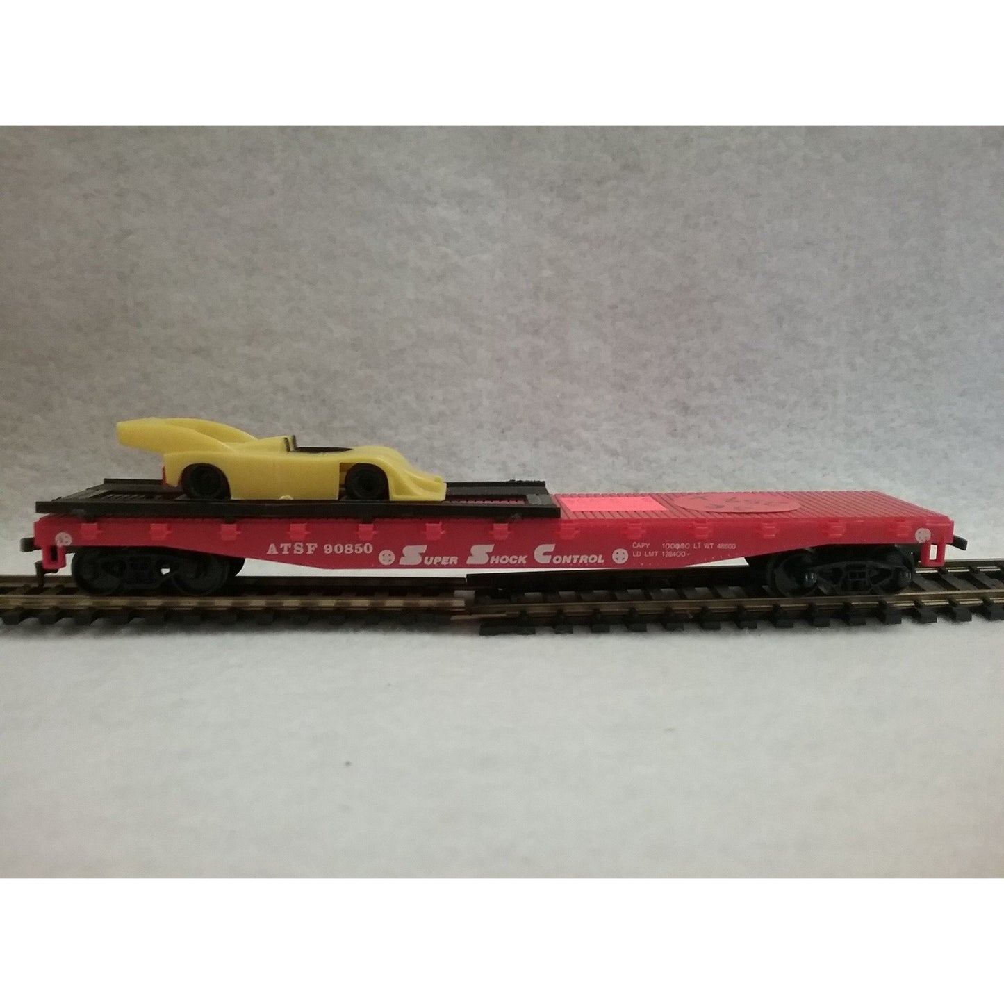 HO Scale AHM ATSF Flat Car with Racecar